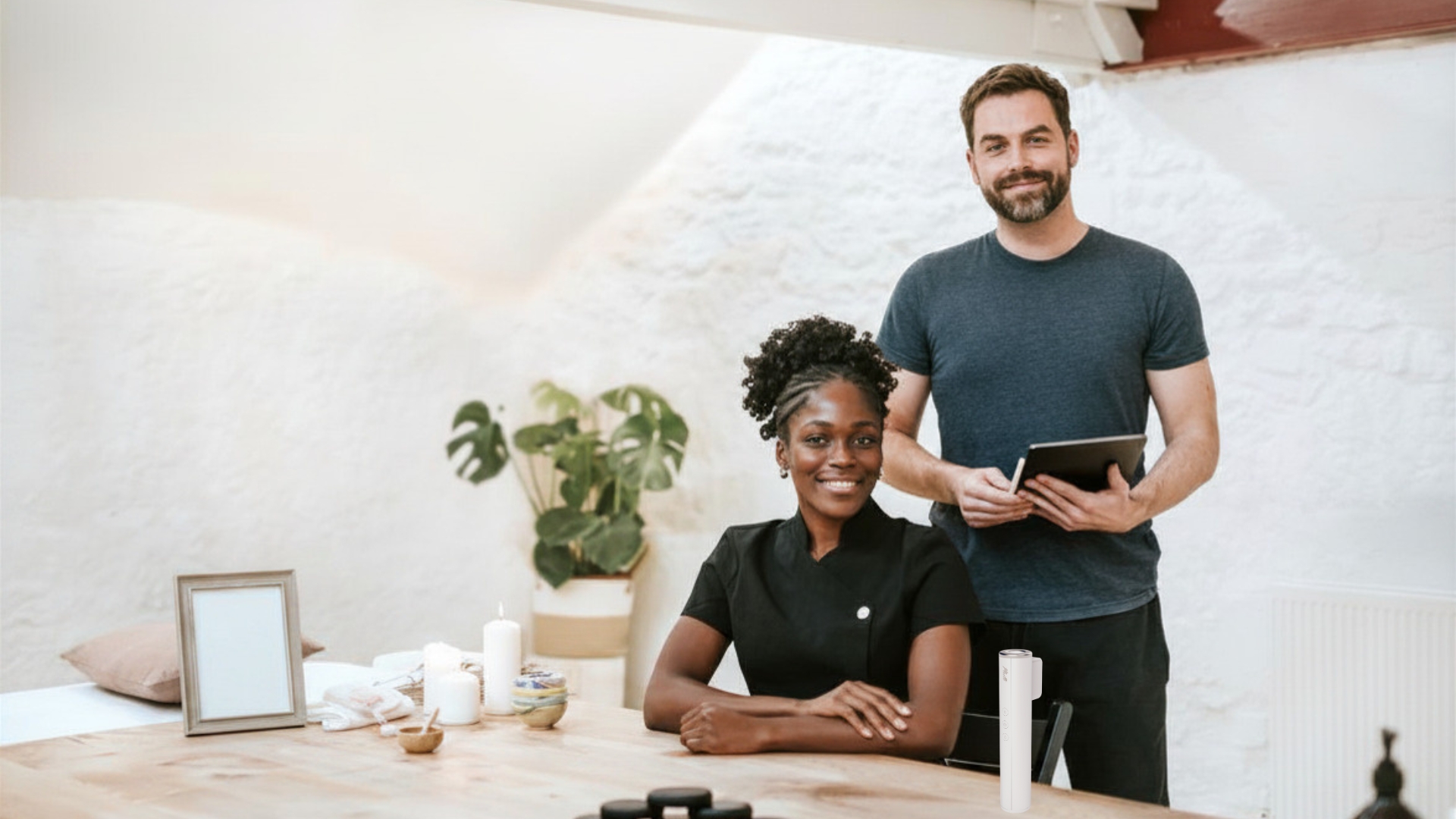 Two skincare professionals in their studio with the Muilli device on the counter
